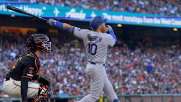 SAN FRANCISCO, CA - JUNE 08: Justin Turner #10 of the Los Angeles Dodgers hits a sacrifice fly scoring Kyle Garlick #41 against the San Francisco Giants in the top of the six inning of a Major League Baseball game at Oracle Park on June 8, 2019 in San Francisco, California. (Photo by Thearon W. Henderson/Getty Images)