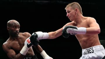Welsh boxer Barrie Jones (R) throws a punch at French boxer and former WBA Light-Welterweight champion of the world Souleymane M'baye during their Light-Welterweight boxing match at the ExCel Arena, in London, on December 6, 2008. AFP PHOTO/Leon Neal (Photo credit should read Leon Neal/AFP via Getty Images)