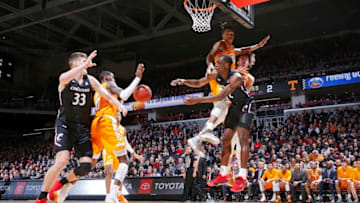 CINCINNATI, OH - DECEMBER 18: Keith Williams #2 of the Cincinnati Bearcats tries to pass under the basket while defended by Yves Pons #35 of the Tennessee Volunteers in the first half of the game at Fifth Third Arena on December 18, 2019 in Cincinnati, Ohio. (Photo by Joe Robbins/Getty Images)