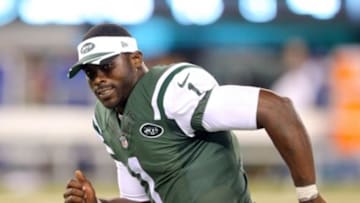 Aug 7, 2014; East Rutherford, NJ, USA; New York Jets quarterback Michael Vick (1) leaves the field after the fourth quarter of a game against the Indianapolis Colts at MetLife Stadium. The Jets defeated the Colts 13-10. Mandatory Credit: Brad Penner-USA TODAY Sports