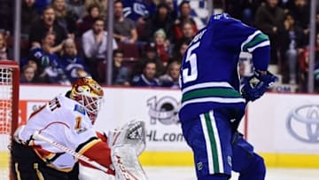 Jan 6, 2017; Vancouver, British Columbia, CAN; Vancouver Canucks forward Michael Chaput (45) shoots the puck against Calgary Flames goaltender Brian Elliott (1) during the first period at Rogers Arena. Mandatory Credit: Anne-Marie Sorvin-USA TODAY Sports