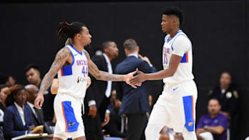 DeVaughnAkoon-Purcell #44 and Justin Patton #13 of the Oklahoma City Blue shake hands during a game against the South Bay Lakers (Photo by Adam Pantozzi/NBAE via Getty Images)