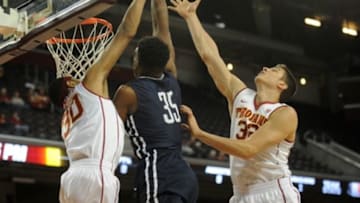 December 13, 2015; Los Angeles, CA, USA; Southern California Trojans guard Elijah Stewart (30) and forward Nikola Jovanovic (32) defend against Yale Bulldogs forward Brandon Sherrod (35) during the first half at Galen Center. Mandatory Credit: Gary A. Vasquez-USA TODAY Sports