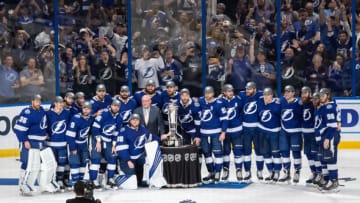 The Tampa Bay Lightning pose with the Prince of Wales Trophy. (Photo by Mike Carlson/Getty Images)