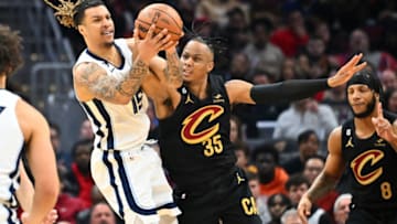 CLEVELAND, OHIO - FEBRUARY 02: Brandon Clarke #15 of the Memphis Grizzlies battles for a loose ball with Isaac Okoro #35 of the Cleveland Cavaliers during the second quarter at Rocket Mortgage Fieldhouse on February 02, 2023 in Cleveland, Ohio. NOTE TO USER: User expressly acknowledges and agrees that, by downloading and or using this photograph, User is consenting to the terms and conditions of the Getty Images License Agreement. (Photo by Jason Miller/Getty Images)
