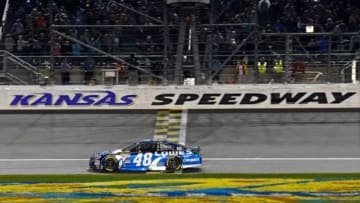 May 9, 2015; Kansas City, KS, USA; NASCAR Sprint Cup Series driver Jimmie Johnson crosses the finish line to win the Spongebob Squarepants 400 at Kansas Speedway. Mandatory Credit: Jasen Vinlove-USA TODAY Sports