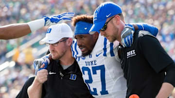 Sep 24, 2016; South Bend, IN, USA; Duke Blue Devils safety DeVon Edwards (27) is helped off the field after being injured in the first quarter against the Notre Dame Fighting Irish at Notre Dame Stadium. Mandatory Credit: Matt Cashore-USA TODAY Sports