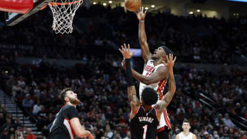 Miami Heat small forward Jimmy Butler (22) shoots the ball against Portland Trail Blazers shooting guard Anfernee Simons (1) (Soobum Im-USA TODAY Sports)