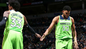 MINNEAPOLIS, MN - DECEMBER 1: Karl-Anthony Towns #32 of the hi-fives Robert Covington #33 of the Minnesota Timberwolves. Copyright 2018 NBAE (Photo by David Sherman/NBAE via Getty Images)