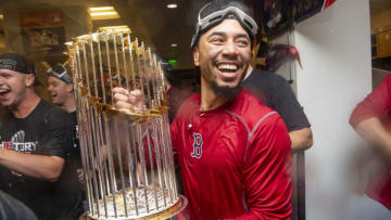 LOS ANGELES, CA - OCTOBER 28: Mookie Betts #50 of the Boston Red Sox celebrates with the World Series trophy after winning the 2018 World Series in game five of the 2018 World Series against the Los Angeles Dodgers on October 28, 2018 at Dodger Stadium in Los Angeles, California. (Photo by Billie Weiss/Boston Red Sox/Getty Images)