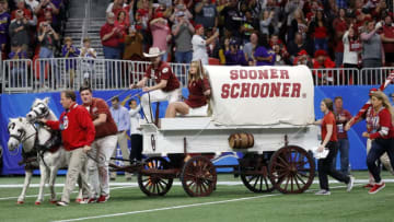 ATLANTA, GEORGIA - DECEMBER 28: Oklahoma Sooners animal mascots Boomer and Sooner pulling Sooner Schooner Conestoga wagon on the field before the game against the LSU Tigers in the Chick-fil-A Peach Bowl at Mercedes-Benz Stadium on December 28, 2019 in Atlanta, Georgia. (Photo by Kevin C. Cox/Getty Images)