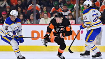 Mar 17, 2023; Philadelphia, Pennsylvania, USA; Philadelphia Flyers right wing Owen Tippett (74) dives between Buffalo Sabres defenseman Henri Jokiharju (10) and defenseman Owen Power (25) in the first period at Wells Fargo Center. Mandatory Credit: Kyle Ross-USA TODAY Sports