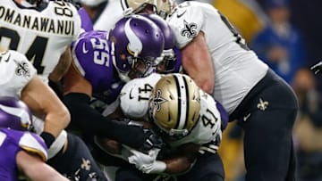 MINNEAPOLIS, MN - JANUARY 14: Anthony Barr #55 of the Minnesota Vikings tackles Alvin Kamara #41 of the New Orleans Saints during the second half of the NFC Divisional Playoff game at U.S. Bank Stadium on January 14, 2018 in Minneapolis, Minnesota. (Photo by Jamie Squire/Getty Images)