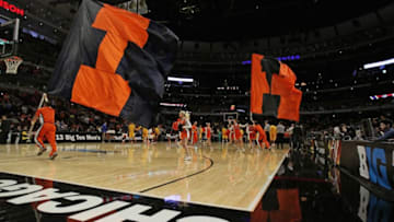 CHICAGO - MARCH 14: The Illinois Fighting Illini cheer team runs around the court against the Minnesota Golden Gophers during a first round game of the Big Ten Basketball Tournament at the United Center on March 14, 2013 in Chicago, Illinois. Illinois defeated Minnesota 51-49. (Photo by Jonathan Daniel/Getty Images)