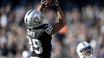 OAKLAND, CA - DECEMBER 24: Amari Cooper #89 of the Oakland Raiders catches a pass against the Indianapolis Colts during the second quarter of their NFL football game at Oakland-Alameda County Coliseum on December 24, 2016 in Oakland, California. (Photo by Thearon W. Henderson/Getty Images)