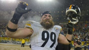 Dec 22, 2013; Green Bay, WI, USA; Pittsburgh Steelers defensive end Brett Keisel (99) reacts after the Steelers beat the Green Bay Packers 38-31 at Lambeau Field. Keisel recovered a fumble late in the 4th quarter to help set up the winning score. Mandatory Credit: Benny Sieu-USA TODAY Sports