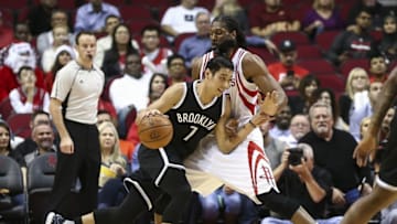 Dec 12, 2016; Houston, TX, USA; Brooklyn Nets guard Jeremy Lin (7) drives the ball as Houston Rockets center Nene Hilario (42) defends during the first quarter at Toyota Center. Mandatory Credit: Troy Taormina-USA TODAY Sports