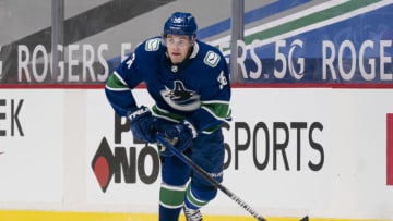VANCOUVER, BC - JANUARY 20: Nils Hoglander #36 of the Vancouver Canucks skates with the puck during NHL hockey action against the Montreal Canadiens at Rogers Arena on January 20, 2021 in Vancouver, Canada. (Photo by Rich Lam/Getty Images)