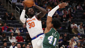 Julius Randle #30 of the New York Knicks shoots the ball to the basket as Saddiq Bey #41 of the Detroit Pistons defends (Photo by Leon Halip/Getty Images).
