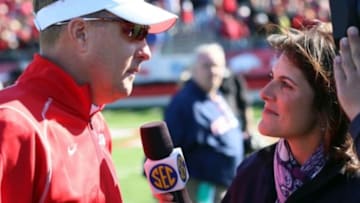 Oct 27, 2012; Little Rock, AR, USA; Ole Miss Rebels head coach Hugh Freeze talks to SEC Network sideline reporter Cara Capuano after the game against the Arkansas Razorbacks at War Memorial Stadium. Mississippi defeated Arkansas 30-27. Mandatory Credit: Nelson Chenault-USA TODAY Sports