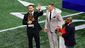 ATLANTA, GEORGIA - FEBRUARY 03: J.J. Watt of the Houston Texans presents the Walter Payton NFL Man of the Year trophy to Chris Long of the Philadelphia Eagles prior to Super Bowl LIII between the New England Patriots and the Los Angeles Rams at Mercedes-Benz Stadium on February 03, 2019 in Atlanta, Georgia. (Photo by Scott Cunningham/Getty Images)