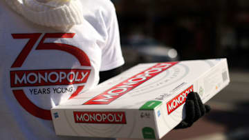 Monopoly promotions staff hand out free Monopoly board games (Photo by Mark Metcalfe/Getty Images)