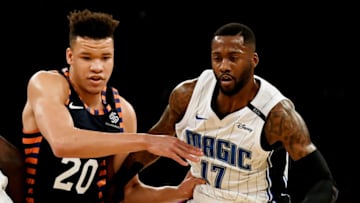 NEW YORK, NY - NOVEMBER 11: Jonathon Simmons #17 of the Orlando Magic dribbles past the defense of Kevin Knox #20 of the New York Knicks during the game at Madison Square Garden on November 11, 2018 in New York City. NOTE TO USER: User expressly acknowledges and agrees that, by downloading and or using this photograph, User is consenting to the terms and conditions of the Getty Images License Agreement. (Photo by Sarah Stier/Getty Images)