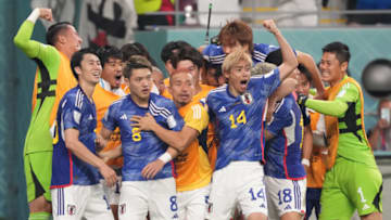 DOHA, QATAR - NOVEMBER 23: Ritsu Doan #8 of Japan celebrates scoring his side's first goal with his team mates during the FIFA World Cup Qatar 2022 Group E match between Germany and Japan at Khalifa International Stadium on November 23, 2022 in Doha, Qatar. (Photo by Etsuo Hara/Getty Images)