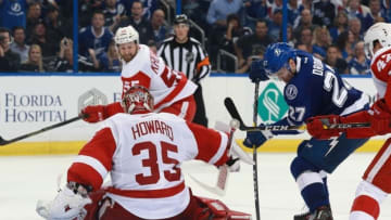Apr 13, 2016; Tampa, FL, USA; Tampa Bay Lightning left wing Jonathan Drouin (27) shoots as Detroit Red Wings goalie Jimmy Howard (35) makes a save during the third period in game one of the first round of the 2016 Stanley Cup Playoffs at Amalie Arena. Tampa Bay Lightning defeated the Detroit Red Wings 3-2. Mandatory Credit: Kim Klement-USA TODAY Sports