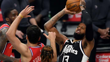 LOS ANGELES, CA - MARCH 27: Paul George #13 of the Los Angeles Clippers shoots and scored a basket after getting fouled by Furkan Korkmaz #30 of the Philadelphia 76ers during the first half of the game at Staples Center on March 27, 2021 in Los Angeles, California. NOTE TO USER: User expressly acknowledges and agrees that, by downloading and or using this photograph, User is consenting to the terms and conditions of the Getty Images License Agreement. (Photo by Kevork Djansezian/Getty Images)