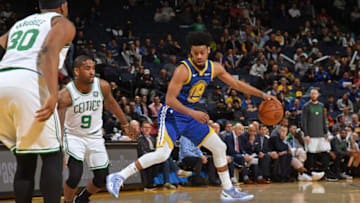 OAKLAND, CA - MARCH 5: Quinn Cook #4 of the Golden State Warriors handles the ball against the Boston Celtics on March 5, 2019 at ORACLE Arena in Oakland, California. NOTE TO USER: User expressly acknowledges and agrees that, by downloading and or using this photograph, user is consenting to the terms and conditions of Getty Images License Agreement. Mandatory Copyright Notice: Copyright 2019 NBAE (Photo by Noah Graham/NBAE via Getty Images)