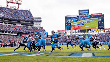 NASHVILLE, TN - DECEMBER 15: Ryan Tannehill #17 hands off the ball to Derrick Henry #22 of the Tennessee Titans during a game against the Houston Texans at Nissan Stadium on December 15, 2019 in Nashville, Tennessee. The Texans defeated the Titans 24-21. (Photo by Wesley Hitt/Getty Images)