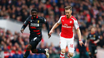 LONDON, ENGLAND - APRIL 04: Aaron Ramsey of Arsenal closes in on goal watched by Kolo Toure of Liverpool during the Barclays Premier League match between Arsenal and Liverpool at Emirates Stadium on April 4, 2015 in London, England. (Photo by Julian Finney/Getty Images)