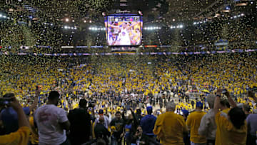 OAKLAND, CA - JUNE 12: Fans cheer as the Golden State Warriors celebrate after defeating the Cleveland Cavaliers 129-120 in Game 5 to win the 2017 NBA Finals at ORACLE Arena on June 12, 2017 in Oakland, California. NOTE TO USER: User expressly acknowledges and agrees that, by downloading and or using this photograph, User is consenting to the terms and conditions of the Getty Images License Agreement. (Photo by Ezra Shaw/Getty Images)
