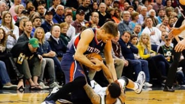 Mar 10, 2014; Salt Lake City, UT, USA; Atlanta Hawks shooting guard Kyle Korver (26) and Utah Jazz point guard Diante Garrett (8) scramble for a loose ball during the second quarter at EnergySolutions Arena. Mandatory Credit: Chris Nicoll-USA TODAY Sports