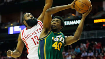 HOUSTON, TX - APRIL 15: James Harden #13 of the Houston Rockets defends against Jeremy Evans #40 of the Utah Jazz during their game at the Toyota Center on April 15, 2015 in Houston, Texas. (Photo by Scott Halleran/Getty Images)