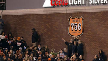 Apr 22, 2016; San Francisco, CA, USA; San Francisco Giants fans pose under a sign to recognize former Giants player and current Miami Marlins hitting coach Barry Bonds (25) record breaking 756 home runs during the third inning at AT&T Park. Mandatory Credit: Kelley L Cox-USA TODAY Sports