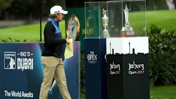 JOHANNESBURG, SOUTH AFRICA - FEBRUARY 23: Eddie Pepperell of England looks at The Open trophy and the Joburg Open trophy on display at the 1st tee during day one of the Joburg Open at the Royal Johannesburg and Kensington Golf Club on February 23, 2017 in Johannesburg, South Africa. (Photo by Warren Little/Getty Images)