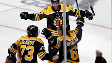 May 19, 2021; Boston, Massachusetts, USA; Boston Bruins center Brad Marchand (63) celebrates his game tying goal against the Washington Capitals with defenseman Charlie McAvoy (73) and center Patrice Bergeron (37) during the third period in game three of the first round of the 2021 Stanley Cup Playoffs at TD Garden. Mandatory Credit: Winslow Townson-USA TODAY Sports
