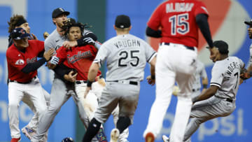 CLEVELAND, OH - AUGUST 05: Jose Ramirez #11 of the Cleveland Guardians (fourth from left) is restrained as Tim Anderson #7 of the Chicago White Sox falls to the ground during a fight in the sixth inning at Progressive Field on August 05, 2023 in Cleveland, Ohio. (Photo by Ron Schwane/Getty Images)