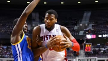 Feb 24, 2014; Auburn Hills, MI, USA; Detroit Pistons cent at Andre Drummond (0) is defended by Golden State Warriors small forward Draymond Green (23) at The Palace of Auburn Hills. Mandatory Credit: Rick Osentoski-USA TODAY Sports