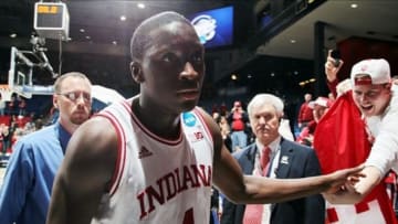 Mar 24, 2013; Dayton, OH, USA; Indiana Hoosiers guard Victor Oladipo (4) high fives a fan as he leaves the court after the win over the Temple Owls during the third round of the 2013 NCAA tournament at University of Dayton Arena. Mandatory Credit: Brian Spurlock-USA TODAY Sports