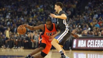 Feb 6, 2016; Oakland, CA, USA; Oklahoma City Thunder guard Dion Waiters (3) dribbles the ball as Golden State Warriors guard Klay Thompson (11) defends in the first quarter at Oracle Arena. Mandatory Credit: Cary Edmondson-USA TODAY Sports