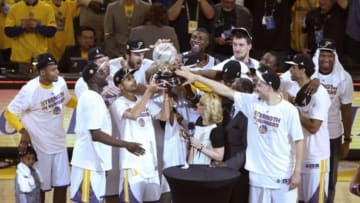 May 27, 2015; Oakland, CA, USA; Golden State Warriors players celebrate with the western conference championship trophy after defeating the Houston Rockets in game five of the Western Conference Finals of the NBA Playoffs at Oracle Arena. Mandatory Credit: Kelley L Cox-USA TODAY Sports