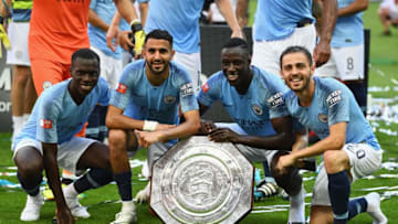 LONDON, ENGLAND - AUGUST 05: Manchester City players celebrate with the Community Shield trophy following their victory during the FA Community Shield between Manchester City and Chelsea at Wembley Stadium on August 5, 2018 in London, England. (Photo by Clive Mason/Getty Images)