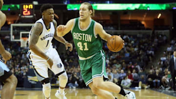 Dec 20, 2016; Memphis, TN, USA; Boston Celtics forward Kelly Olynyk (41) drives against Memphis Grizzlies forward Jarell Martin (1) in the second quarter at FedExForum. Mandatory Credit: Nelson Chenault-USA TODAY Sports
