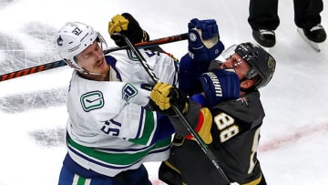 EDMONTON, ALBERTA - SEPTEMBER 04: Tyler Myers #57 of the Vancouver Canucks and Nate Schmidt #88 of the Vegas Golden Knights scuffle during the third period in Game Seven of the Western Conference Second Round during the 2020 NHL Stanley Cup Playoffs at Rogers Place on September 04, 2020 in Edmonton, Alberta, Canada. (Photo by Bruce Bennett/Getty Images)