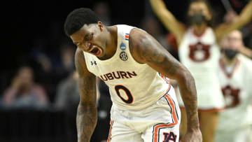 Auburn basketball players bid farewell to the 2021-22 season. (Photo by Eakin Howard/Getty Images)