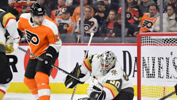 Mar 8, 2022; Philadelphia, Pennsylvania, USA; Vegas Golden Knights goaltender Robin Lehner (90) makes a save as Philadelphia Flyers left wing James van Riemsdyk (25) looks for the rebound during the second period at Wells Fargo Center. Mandatory Credit: Eric Hartline-USA TODAY Sports