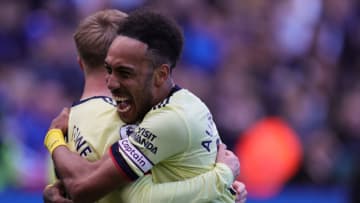 LEICESTER, ENGLAND - OCTOBER 30: Emile Smith Rowe of Arsenal celebrates with teammate Pierre-Emerick Aubameyang after scoring their sides second goal of the match to make it 2-0 during the Premier League match between Leicester City and Arsenal at The King Power Stadium on October 30, 2021 in Leicester, England. (Photo by James Holyoak/MB Media/Getty Images )